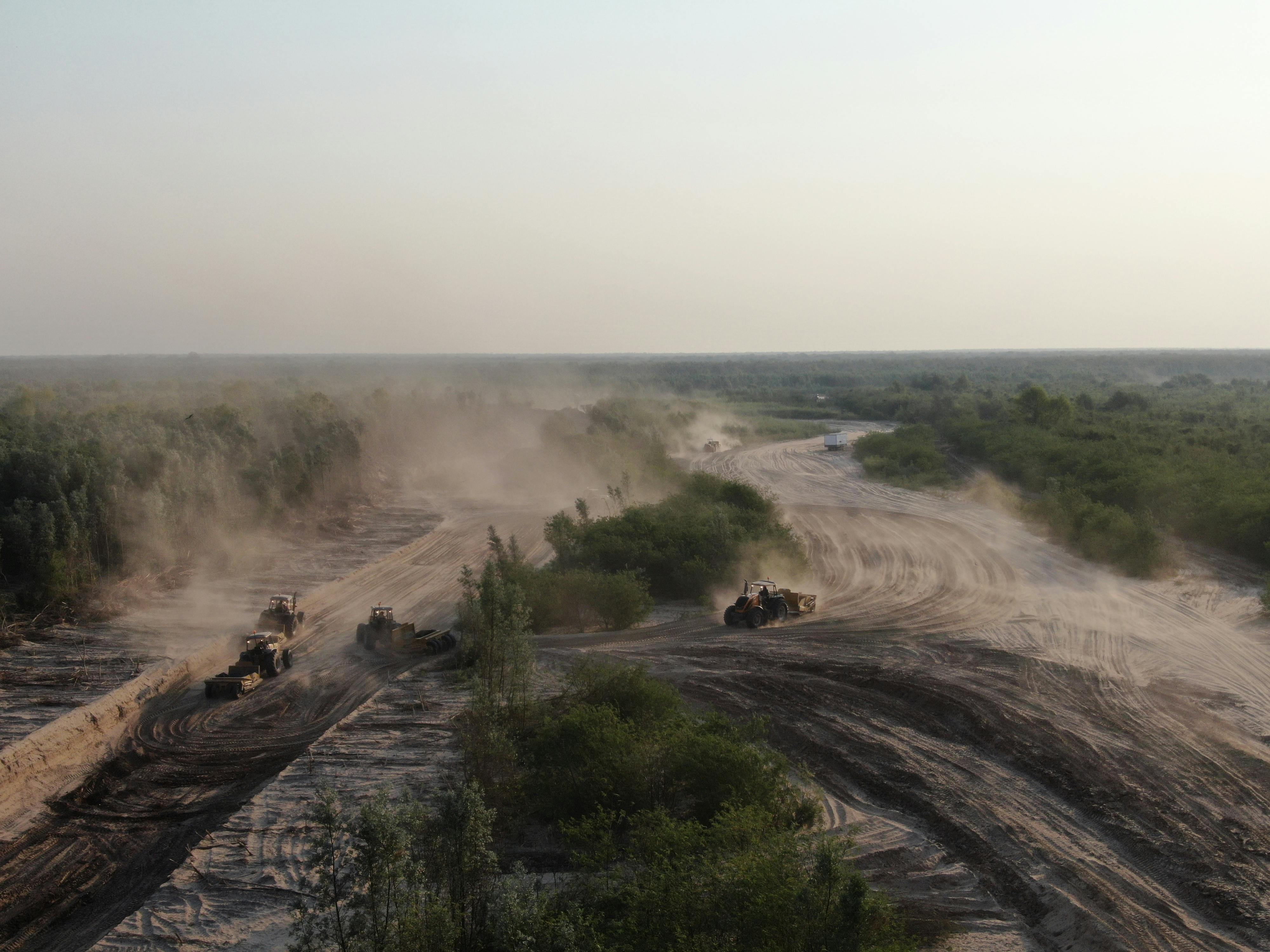 Land clearing operation at dusk