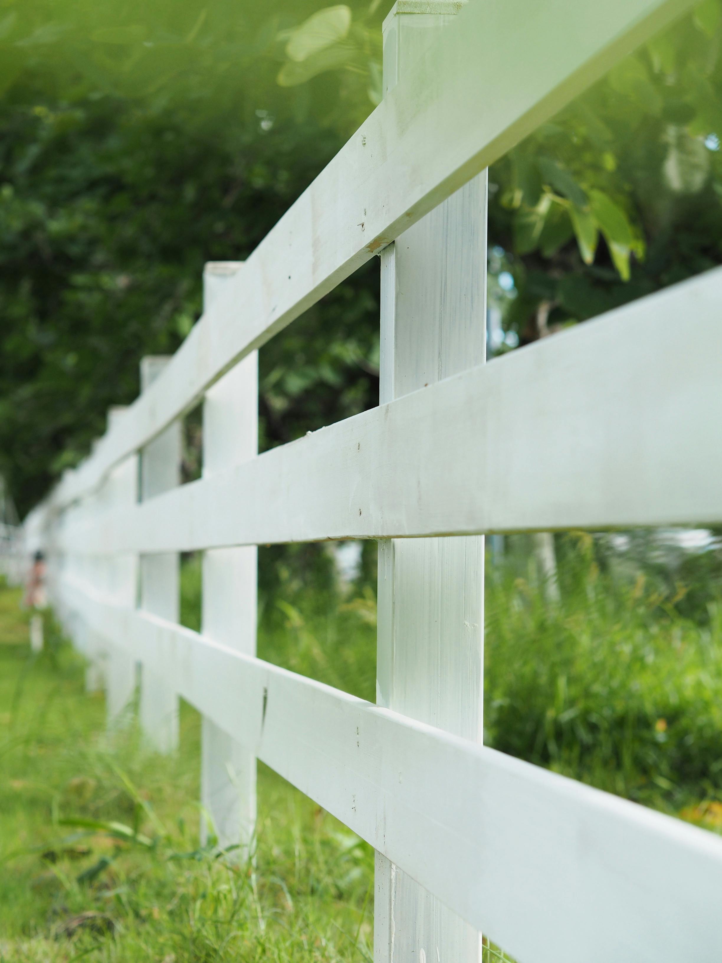 Clean white ranch fence perspective view